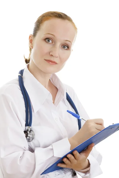 Příjemný lékař žena zapisování poznámek — Stock fotografie