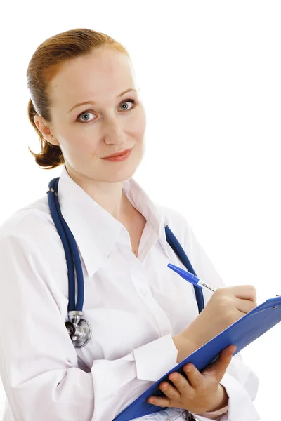 Friendly medical doctor woman taking notes — Stock Photo, Image