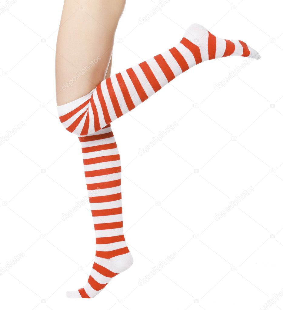 Woman legs in color red socks isolated on white.