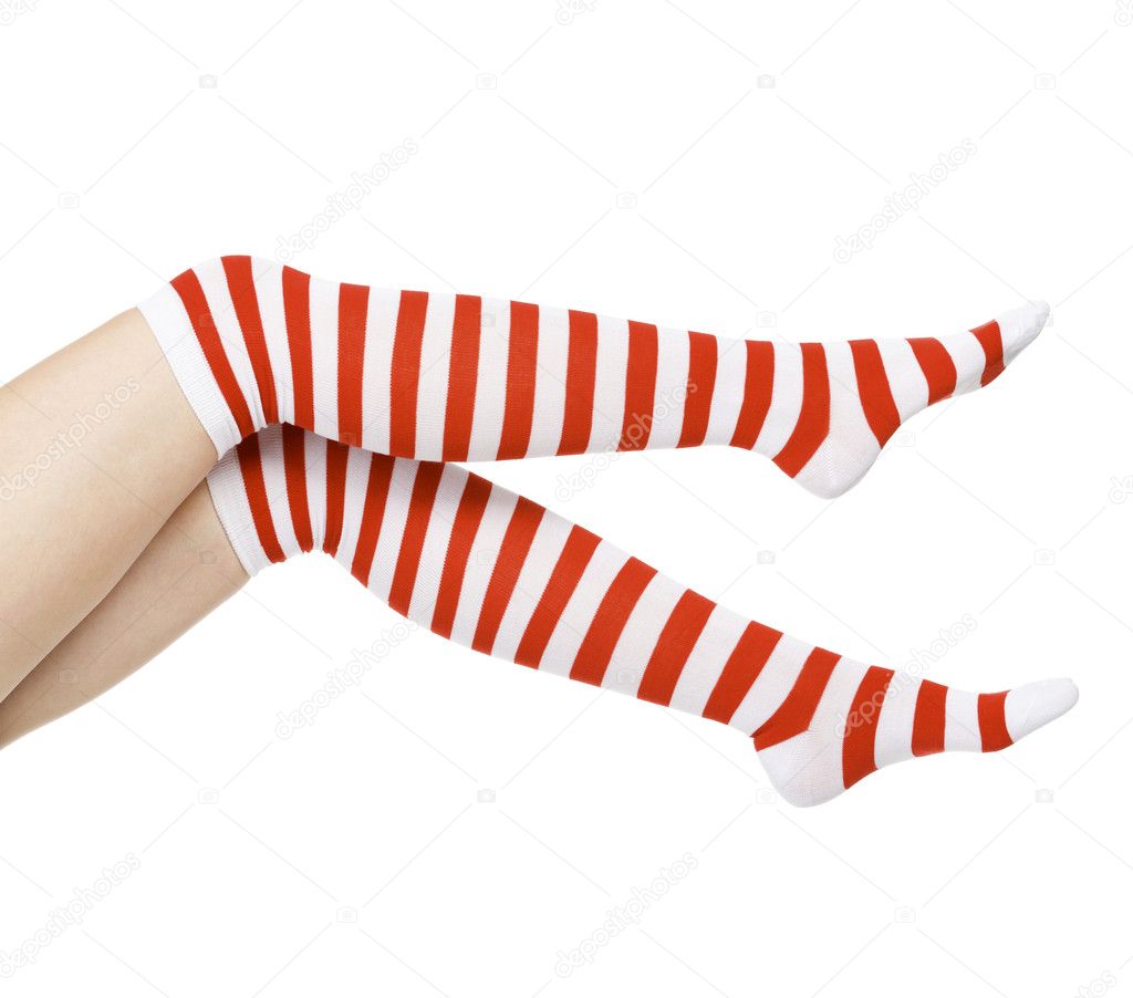Woman legs in color red socks isolated on white