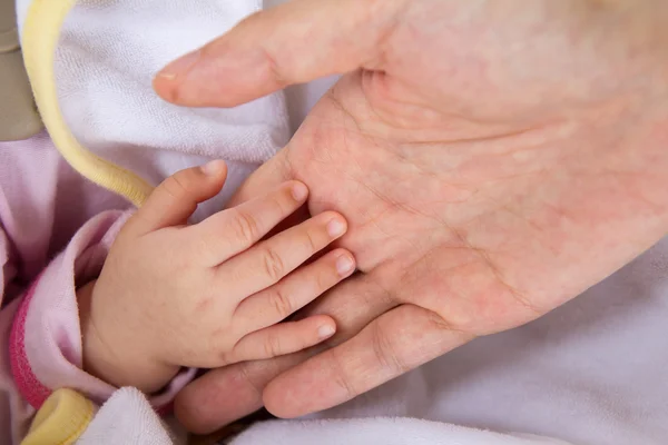 Stock image Baby hand in mother's palm