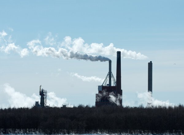 Smoking industrial plant in winter