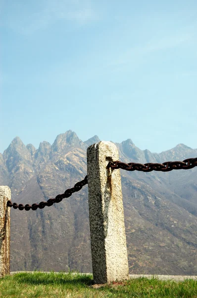 Fence made of iron and stones, vertical — Stock Photo, Image
