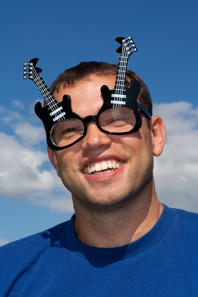 Young man in funny glasses — Stock Photo, Image