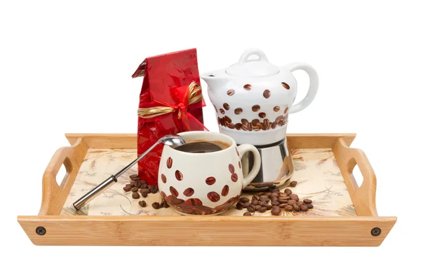 Coffee pot with cup, red bag on wooden tray — Stock Photo, Image