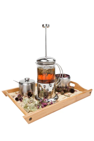 Tetera con té de hierbas, taza y tazón de azúcar — Foto de Stock