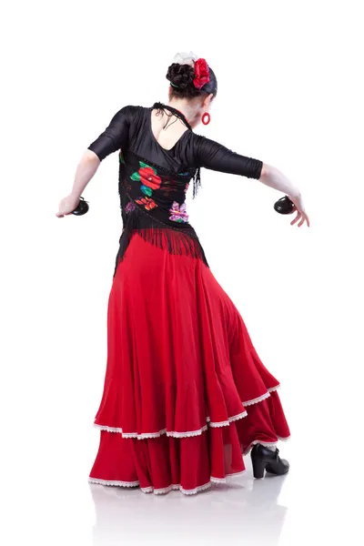 Молода жінка танцює фламенко з кастанетами ізольовані на білому — стокове фото