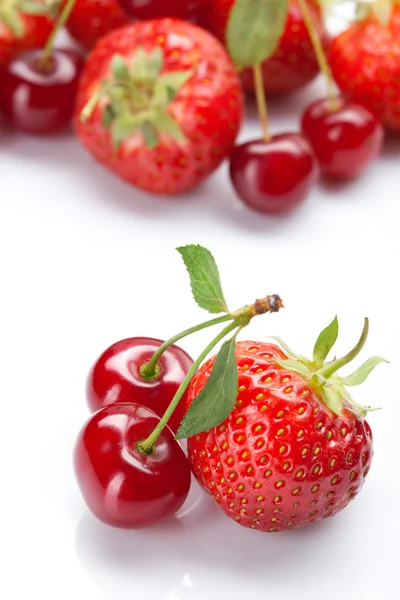 Strawberry and cherry on white — Stock Photo, Image