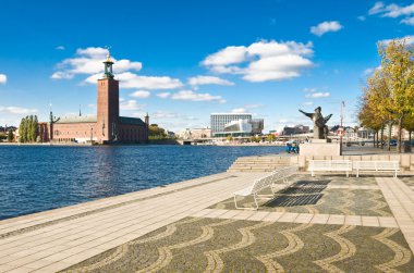 Stockholm city hall and quay in summer clipart