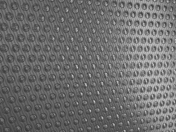 Carbon fibre surface with round shapes — Stock Photo, Image