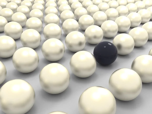 Black extraordinary pearl among white ones — Stockfoto