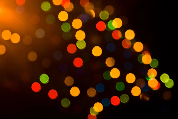 Luces coloridas festivas sobre negro —  Fotos de Stock