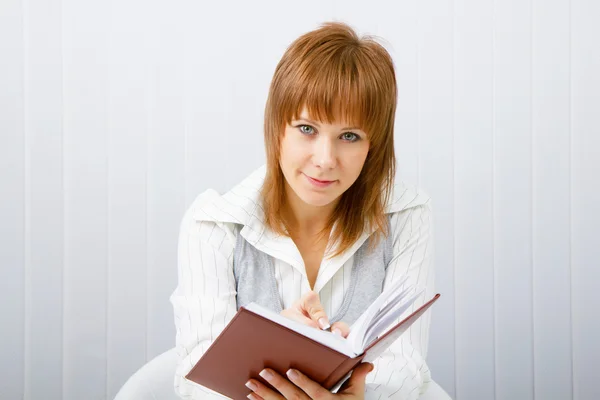 Business woman with book — Stock Photo, Image