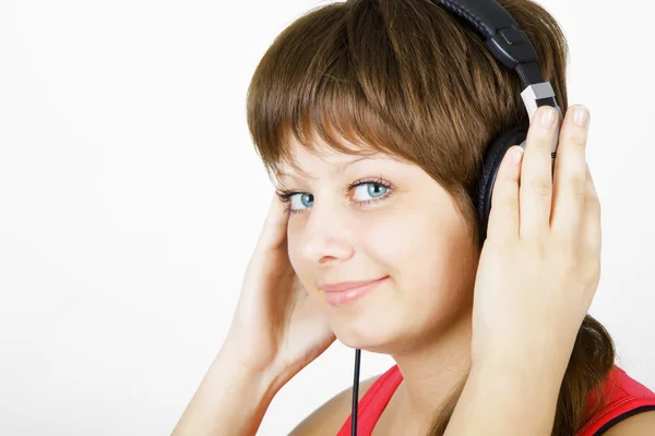 Menina adolescente nos fones de ouvido — Fotografia de Stock