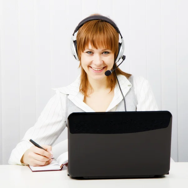 Girl in headphones with a microphone Stock Picture