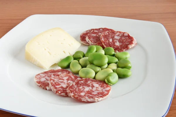 Dish with beans salami and cheese — Stock Photo, Image