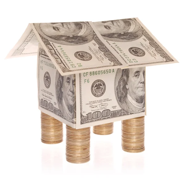 The house from dollars costs on coins. — Stock Photo, Image