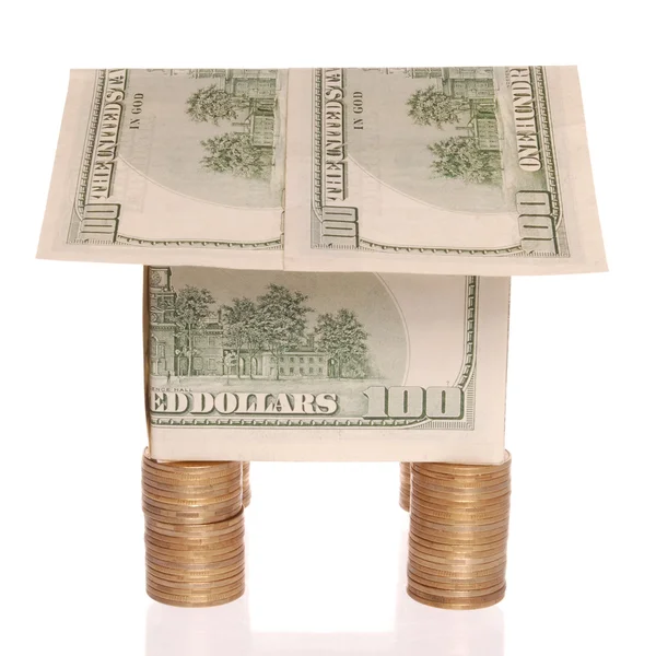 La casa de los dólares cuesta en las monedas . —  Fotos de Stock