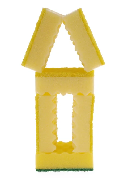 Casa feita de esponjas amarelas — Fotografia de Stock