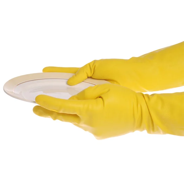 Plate in yellow gloved hands — Stock Photo, Image