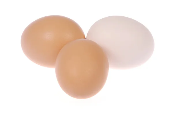 Tre ägg. en äggvita. — Stockfoto