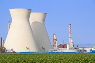 Nuclear power station ander blue sky clipart