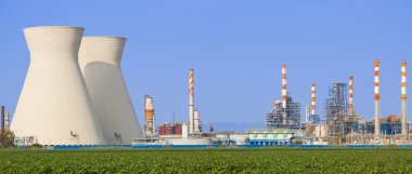 Nuclear power station under blue sky clipart