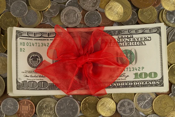 Dollars with Ribbon and coins — Stock Photo, Image