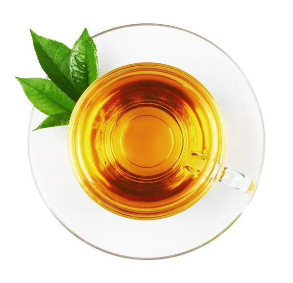 Cup with tea and green leaf — Stock Photo, Image