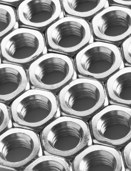 Metal nuts background — Stock Photo, Image
