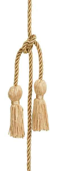 Золотая веревка с кисточкой — стоковое фото
