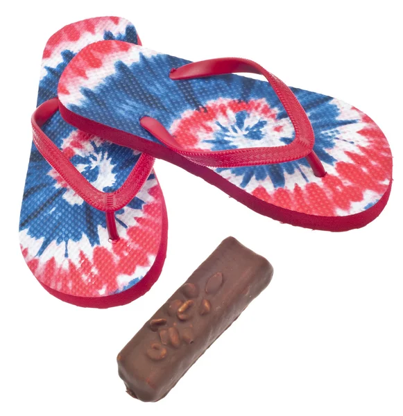 Tie Dye Flip Flop Sandals with Ice Cream Candy Bar. — Stock Photo, Image