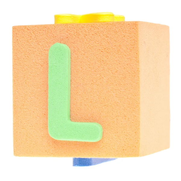 Буква L на пеноблоке — стоковое фото