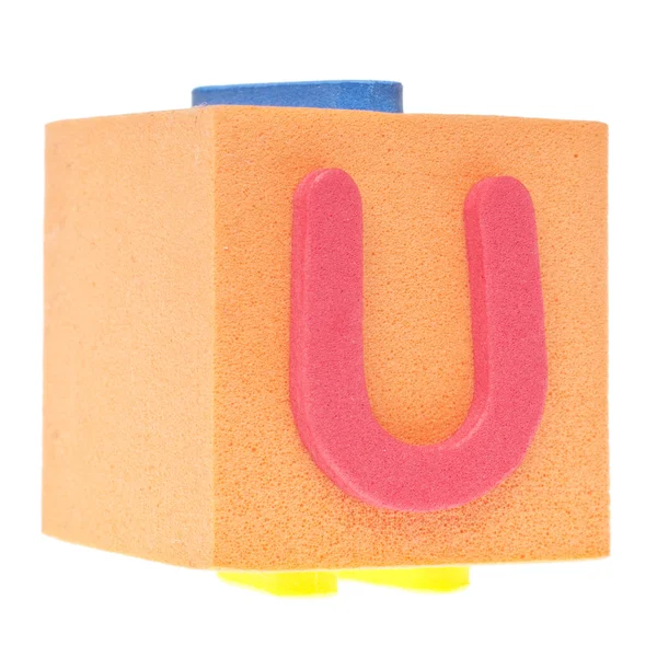 Буква U на пеноблоке — стоковое фото