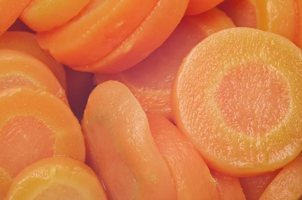 Närbild bakgrund av konserverad morötter — Stockfoto