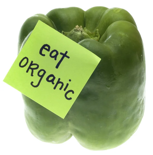 Grüne Paprika mit Bio-Botschaft essen — Stockfoto