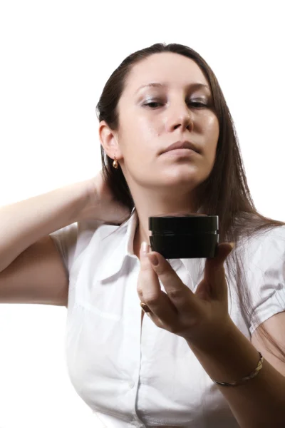 Woman and a cosmetic cream — Stock Photo, Image
