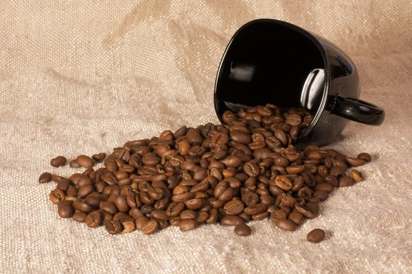 Mug with coffee beans — Stock Photo, Image