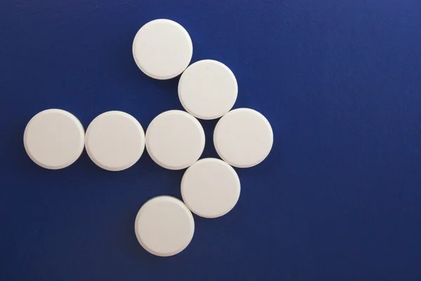 stock image Arrow of white tablets