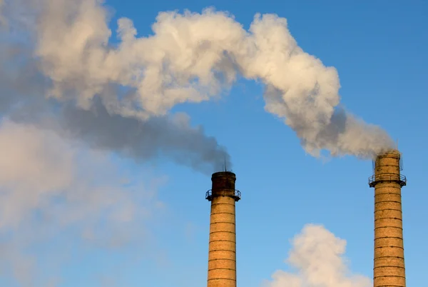 stock image Brick pipes with a smoke