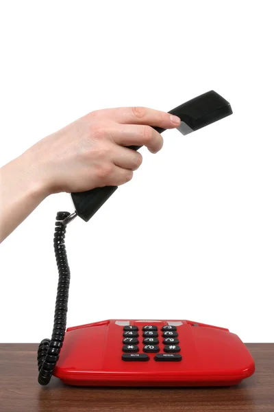 Receptor de telefone em uma mão feminina — Fotografia de Stock