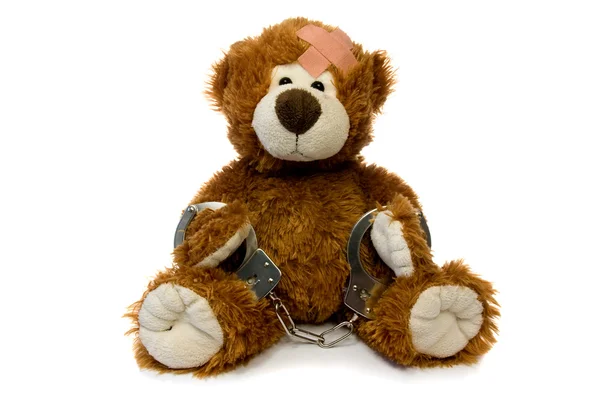 Injured and handcuffed Teddy bear. — Stock Photo, Image