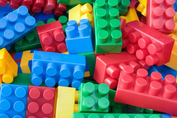 Various colorful plastic bricks. — Stock Photo, Image