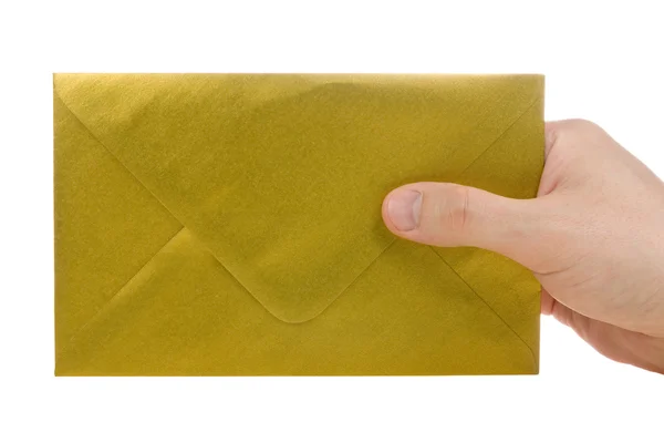 Mão com envelope ouro. — Fotografia de Stock