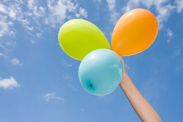 Hand with color balloons — Stock Photo, Image