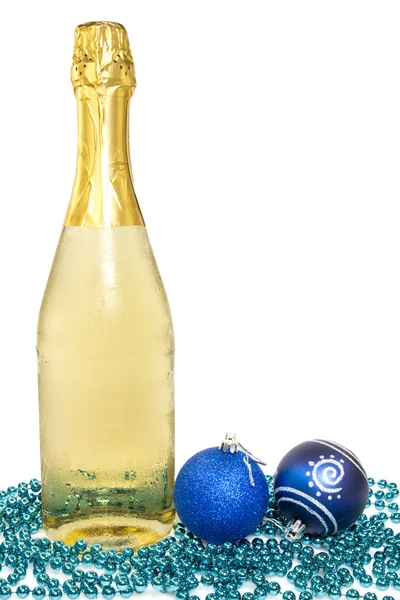 Champagne and christmas baubles — Stock Photo, Image