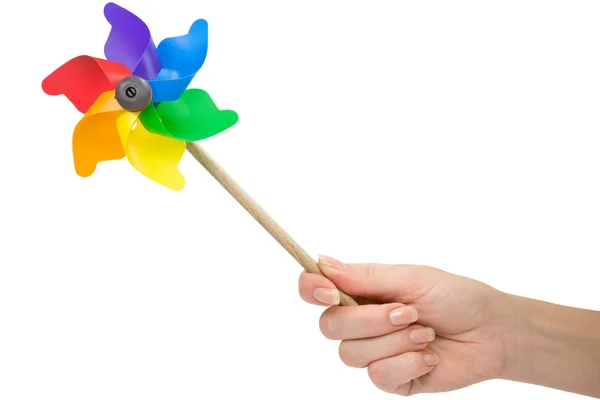 Ruka s barevný větrník — Stock fotografie