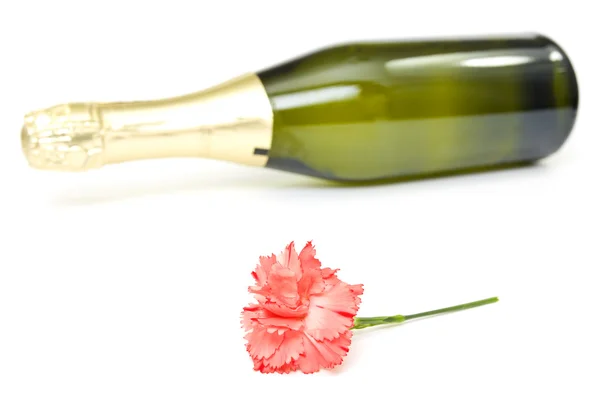 Red carnation and champagne. — Stock Photo, Image