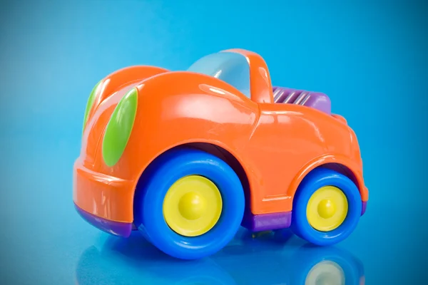 Оранжевый автомобиль игрушки — стоковое фото