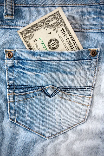 Een dollar in de jeans zak. — Stockfoto